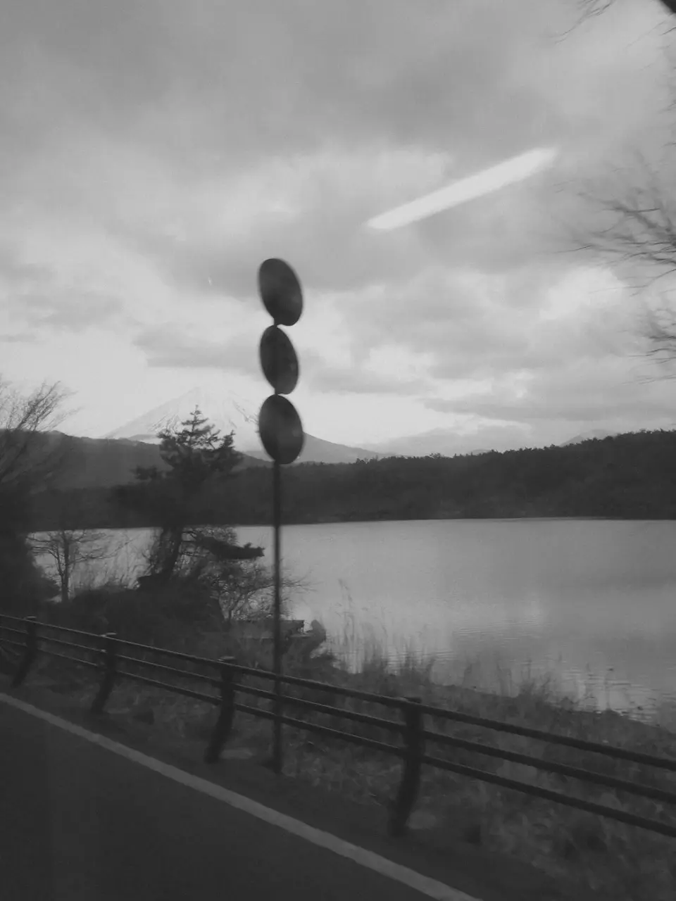 Mt. Fuji and a lake. Black-and-white photo.